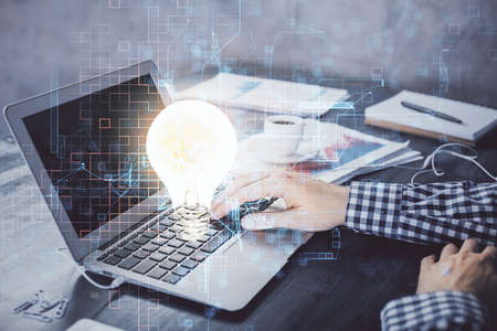 Growing arrows with businessman working on computer on background. Success concept. Double exposure.の写真素材