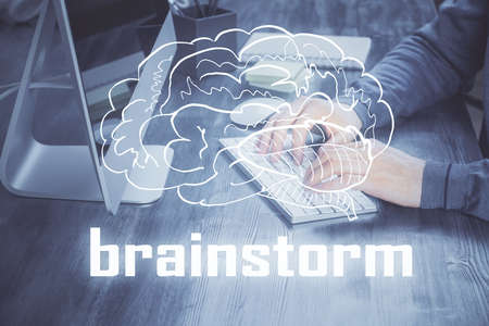 Start up drawings with businessman working on computer on background. Teamwork concept. Double exposure.の写真素材