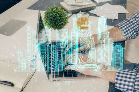 High tech city drawing with businessman working on computer on background. Smartcity concept. Double...