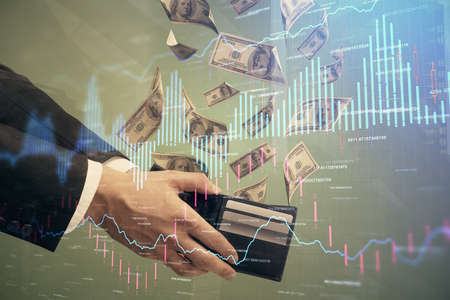 Multi exposure of financial graph drawing hologram and USA dollars bills and man hands. Analysis...