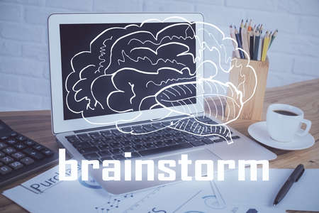 Desktop computer background in office and start up theme hologram drawing. Double exposure. Startup concept.の写真素材