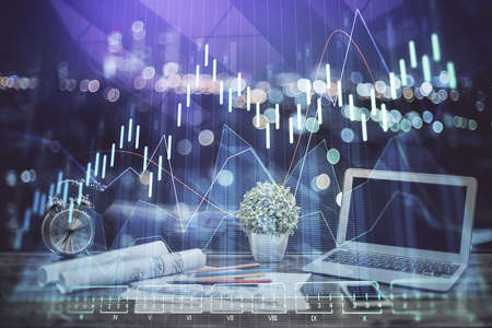 Double exposure of forex chart and work space with computer. Concept of international online...