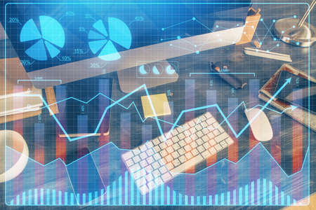 Double exposure of forex graph and work space with computer. Concept of international online...