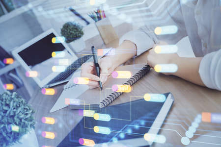 Multi exposure of woman hands on background with technology coding hologram. Data concept.の写真素材