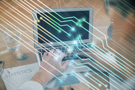 Businessman with computer background with technology theme hologram. Concept of big data. Double...