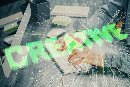 Start up drawings with businessman working on computer on background. Teamwork concept. Double...