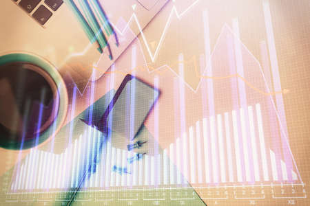 Double exposure of forex graph drawing over desktop background with computer. Concept of financial...