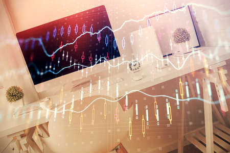 Double exposure of financial graph drawing and office interior background. Concept of stock market.