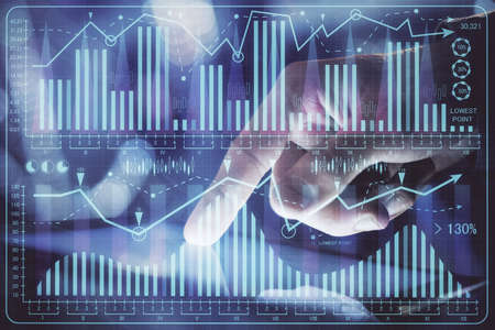 Multi exposure of man's hands holding and using a phone and financial chart drawing. Market analysis...