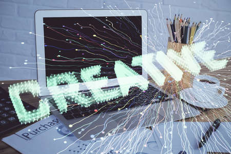 Desktop computer background in office and start up theme hologram drawing. Double exposure. Startup...