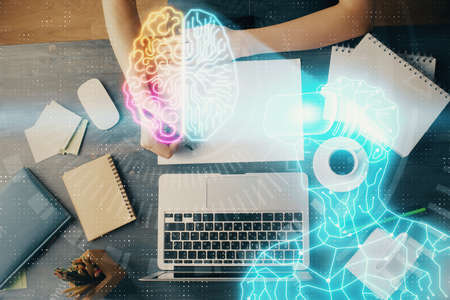 AR hologram over woman's hands taking notes background. Concept of augmented reality. Multi exposureの写真素材