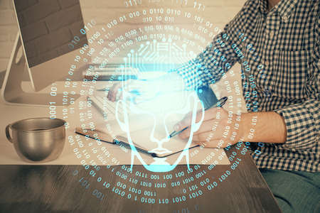 Man typing on keyboard background with brain hologram. Concept of big Data. Double exposure.