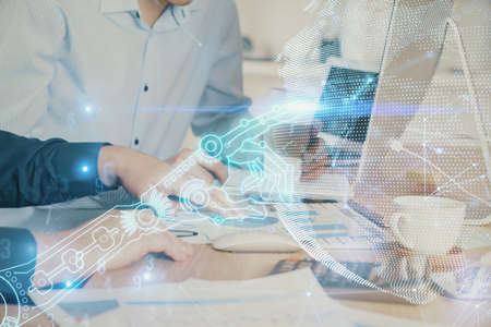 Technology theme hologram with man working on computer on background. High tech concept. Multi...