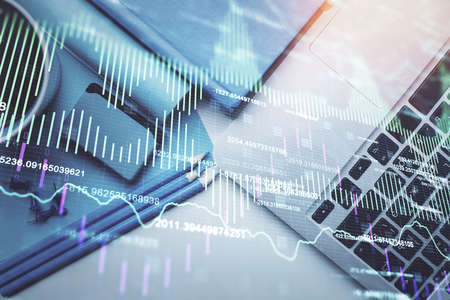 Double exposure of forex graph drawing over desktop background with computer. Concept of financial...