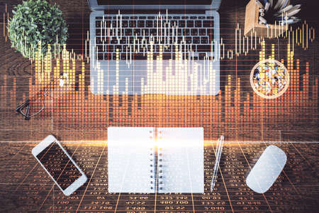 Stock market graph and top view computer on the table background. Multi exposure. Concept of...