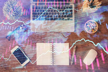 Stock market graph and top view computer on the table background. Multi exposure. Concept of...