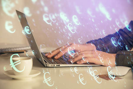 Double exposure of businesswoman hands typing on computer and forex graph hologram drawing. Financial analysis concept.の写真素材