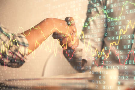 Double exposure of forex graph hologram and handshake of two men. Stock market concept.