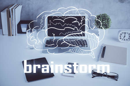 Desktop computer background in office and start up theme hologram drawing. Double exposure. Startup concept.の写真素材