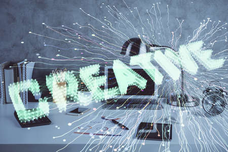 Desktop computer background in office and start up theme hologram drawing. Double exposure. Startup concept.の写真素材