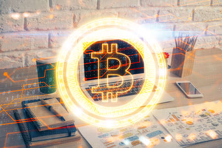 Double exposure of blockchain theme hologram and table with computer background. Concept of bitcoin crypto currency.の写真素材