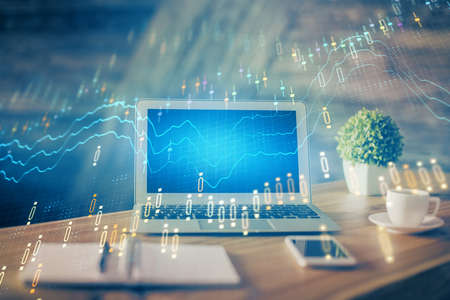 Financial graph colorful drawing and table with computer on background. Double exposure. Concept of...