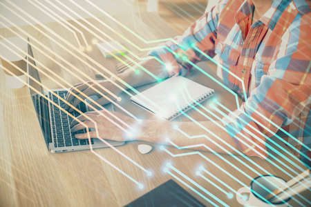 Businessman with computer background with technology theme hologram. Concept of big data. Double exposure.の写真素材