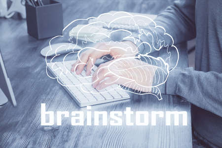 Start up drawings with businessman working on computer on background. Teamwork concept. Double exposure.の写真素材