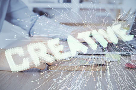 Start up drawings with businessman working on computer on background. Teamwork concept. Double exposure.の写真素材