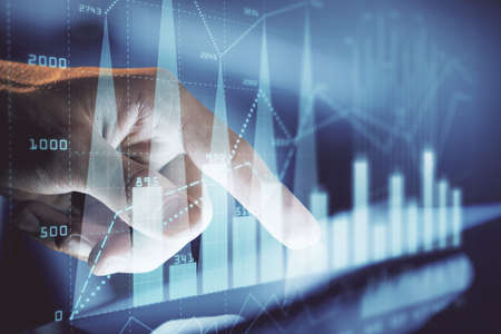 Multi exposure of mans hands holding and using a phone and financial chart drawing. Market analysis...