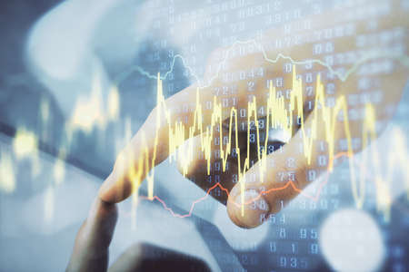Multi exposure of mans hands holding and using a phone and financial chart drawing. Market analysis...