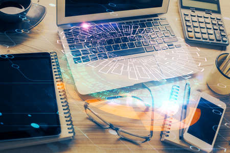 Double exposure of table with computer on background and data theme drawing. Concept of innovation.
