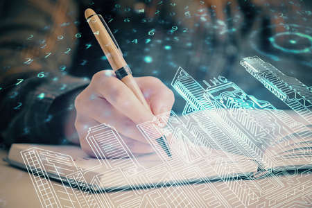 IOT drawing over writing hands in notepad background. Concept of smaert home. Multi exposureの写真素材