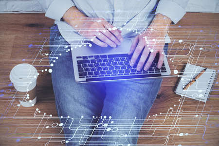 Multi exposure of technology hologram with man working on computer background. Concept of big data.