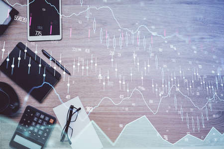 Double exposure of forex graph drawing and work table top veiw. Concept of financial analysis.