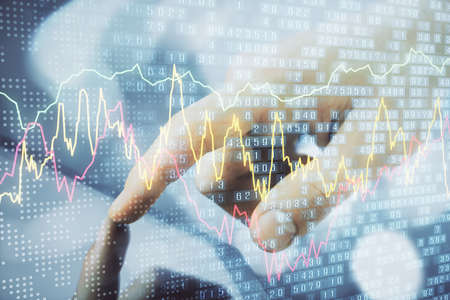 Multi exposure of mans hands holding and using a phone and financial chart drawing. Market analysis...