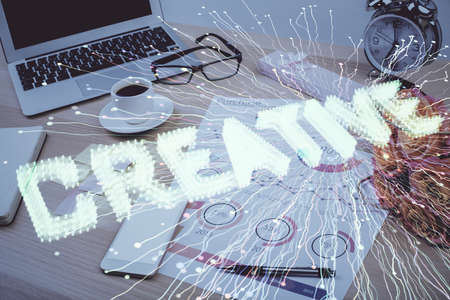 Desktop computer background in office and start up theme hologram drawing. Double exposure. Startup...