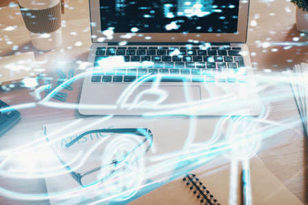 Desktop computer background in office with automobile hologram drawing. Multi exposure. Tech...