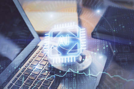 Double exposure of desktop computer and technology theme hologram. Concept of software development.
