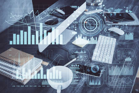 Multi exposure of graph and financial info and work space with computer background. Concept of...