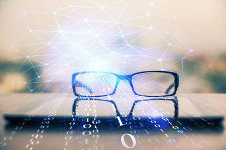 Data tech hologram with glasses on the table background. Concept of technology. Double exposure.