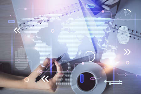 Multi exposure of hands making notes with world map hologram and data theme icons. Concept of global...