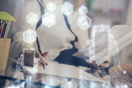 Technology theme hologram over womans hands taking notes background. Concept of Tech. Double...