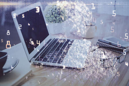 Computer on desktop in office with technology theme hologram. Double exposure. Tech concept.の写真素材