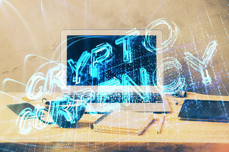 Double exposure of blockchain theme hologram and table with computer background. Concept of bitcoin crypto currency.の写真素材