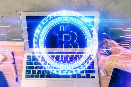 Double exposure of blockchain theme hologram and table with computer background. Concept of bitcoin...