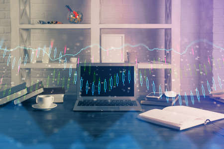 Financial chart drawing and table with computer on background. Double exposure. Concept of...