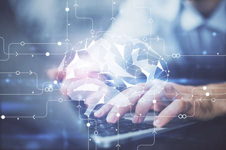 Businessman with computer background with brain theme hologram. Concept of brainstorm. Multi...