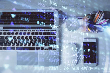 Multi exposure of forex graph drawing over desktop background with computer. Concept of financial...