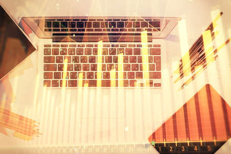 Multi exposure of forex chart drawing over table background with computer. Concept of financial research and analysis. Top view.の写真素材
